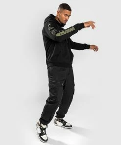 Venum Fangs Hoodie Regular Fit - Black 12 Venum Fangs Hoodie Regular Fit - Black -Boxing Sport Store 4 252Fe 252Fa 252Fa 252F4eaa87f01670deee17d2041ee9c91bd102c61325 HOODIES FANGS BLACK 2 06