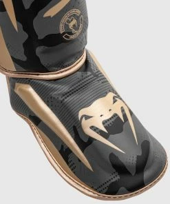 Venum Elite Shin Guards - Dark Camo/Gold 12 Venum Elite Shin Guards - Dark Camo/Gold -Boxing Sport Store SHINGUARD ELITE 3.0 BLACK GOLD 1500 03 2